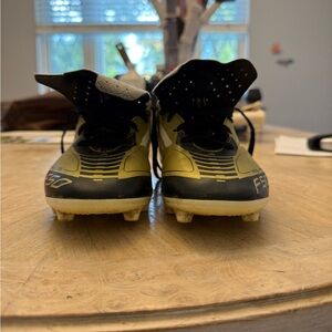 Kids Black and Gold Soccer Cleats